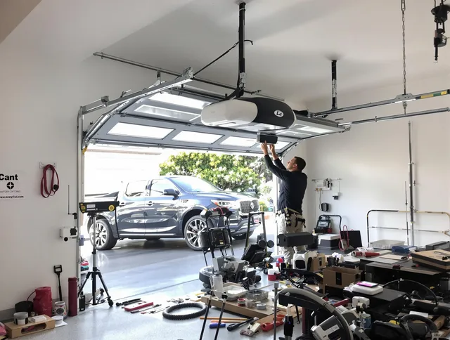 Watertown Garage Door Repair specialist installing smart garage door opener system in Watertown home
