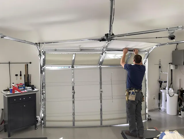 Watertown Garage Door Repair specialist performing precise section replacement on Watertown garage door