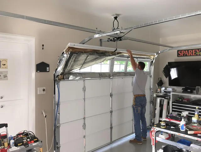 Garage door section replacement by Watertown Garage Door Repair in Watertown
